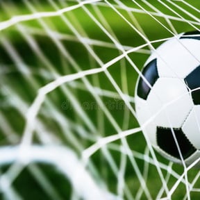 soccer-ball-goal-green-grass-94864016.jpeg
