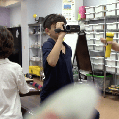 Kid with camera.png