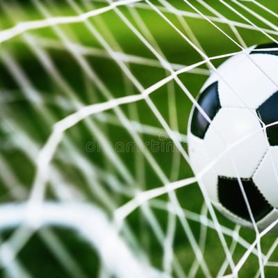 soccer-ball-goal-green-grass-94864016.jpeg