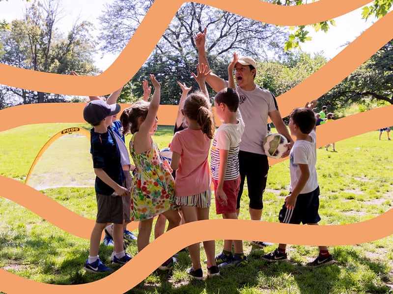Adult with children playing