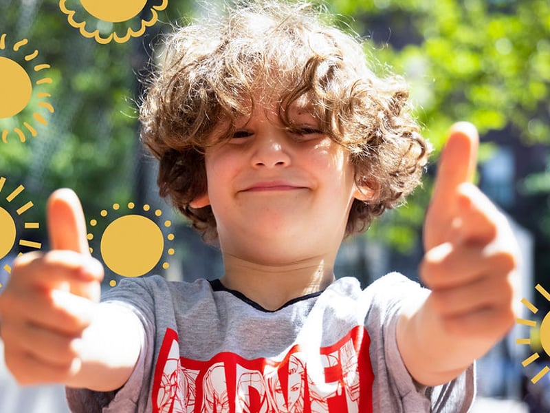 Boy giving thumbs up