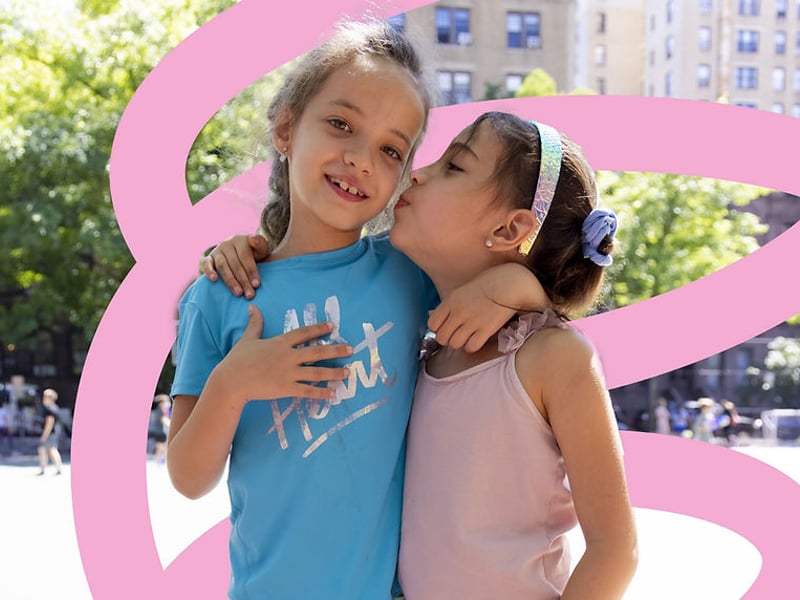 2 young girls embracing