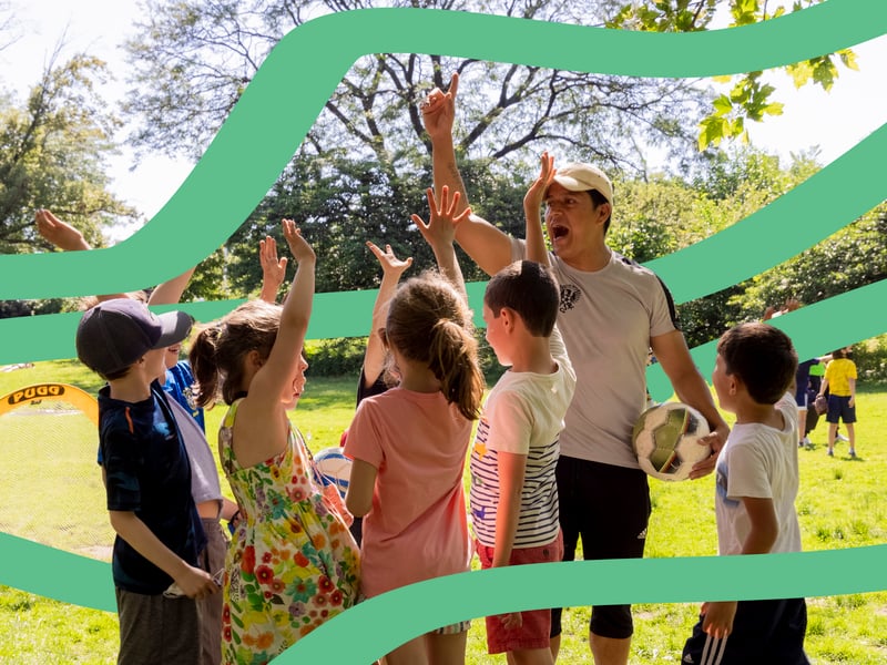 Kids and instructor playing outdoors