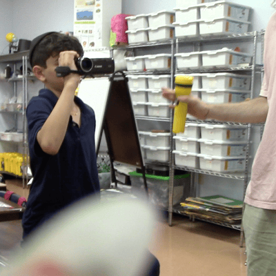 Kid with camera.png